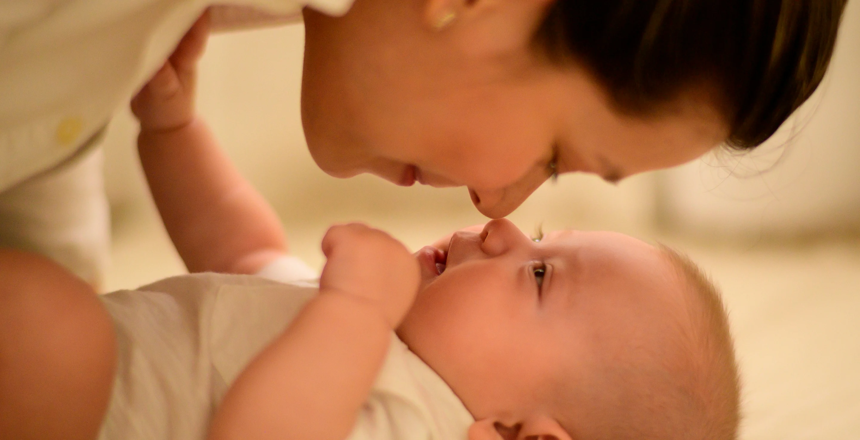 Mother holding her baby close