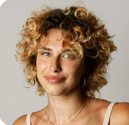 Smiling woman with curly hair