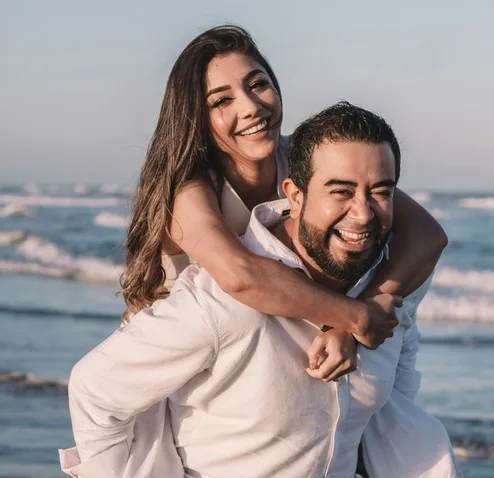 Smiling couple embracing outdoors