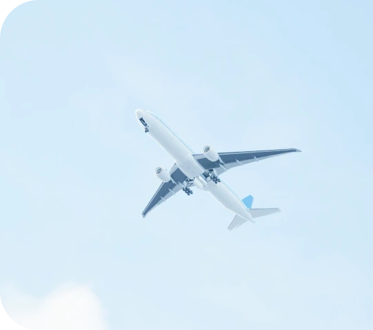 A passenger jet climbing through a clear blue sky