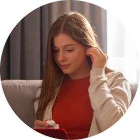 A woman reviewing surrogate pay details on her phone